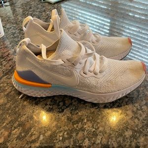 Womens Nike epic React flyknit sneaker. Size 7. Used in excellent condition